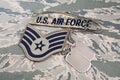 US AIR FORCE branch tape and Staff Sergeant rank patch and dog tags on digital tiger stripe pattern uniform Royalty Free Stock Photo