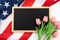 US American flag with blackboard and tulip on white background. For USA Memorial day, Presidents day, Veterans day, Labor day, Royalty Free Stock Photo