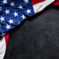 US American flag on worn black background. For USA Memorial day, Veteran`s day, Labor day, or 4th of July celebration. With blank Royalty Free Stock Photo