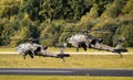 US Army Boeing AH-64E Apache attack helicopters taking off from an airbase. The Netherlands - October 27, 2017