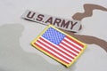 US ARMY branch tape and US flag patch on desert camouflage uniform Royalty Free Stock Photo