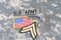 US ARMY Corporal rank patch, airborne tab, flag patch, with dog tag on camouflage uniform