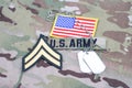 US ARMY Corporal rank patch, flag patch, with dog tag on camouflage uniform