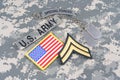 US ARMY Corporal rank patch, special forces tab, flag patch, with dog tag on camouflage uniform