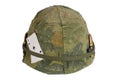 US Army helmet Vietnam war period with camouflage cover and ammo belt and amulet Royalty Free Stock Photo