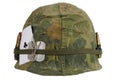 US Army helmet Vietnam war period with camouflage cover and ammo belt, dog tag and amulet ace of clubs playing card Royalty Free Stock Photo