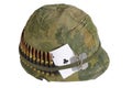 US Army helmet Vietnam war period with camouflage cover and ammo belt, dog tag and amulet Royalty Free Stock Photo