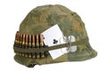 US Army helmet Vietnam war period with camouflage cover and ammo belt, dog tag and amulet Royalty Free Stock Photo