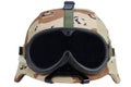 us army kevlar helmet with a desert camouflage cover and protective goggles Royalty Free Stock Photo