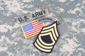 US ARMY Master Sergeant rank patch, airborne tab, flag patch, with dog tag on camouflage uniform