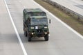 US army military convoy passes in Czech Republic. Military 6 -wheel truck drives on highway