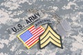 US ARMY Sergeant rank patch, airborne tab, flag patch, with dogs tags on camouflage uniform