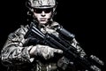 US army soldier with rifle on black background