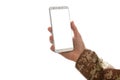 Young soldier holding a mobile phone with blank screen on white background Royalty Free Stock Photo