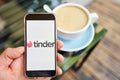 US, California - June 23 2023: Tinder logo. Dating app in mobile phone screen. Man swiping and liking profiles on Royalty Free Stock Photo