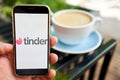 US, California - June 23 2023: Tinder logo. Dating app in mobile phone screen. Man swiping and liking profiles on Royalty Free Stock Photo