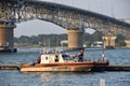 US Coastguard boats moored in the York River off Yorktown beach under the Coleman Memorial Bridge. Yorktown VA, USA. Royalty Free Stock Photo