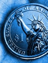 US coin lies on the palm. Blue tinted vertical illustration. Economy and finance. 1 one dollar coin close-up. The Statue of