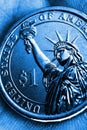 US coin lies on the palm. Deep blue tinted vertical illustration. Economy, finance or banking. 1 one dollar coin close-up. The