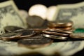 US Coins and Dollars in a pile selective focus foreground dollar Royalty Free Stock Photo