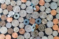 US coins on flat surface with washers wing nuts