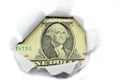 US currency peeking through white paper.