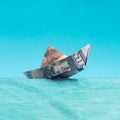 US dollar banknote created boat sinking into sea. Minimal abstract banking system concept Royalty Free Stock Photo