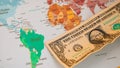 US dollar banknotes on globe world map, American investment and trading Royalty Free Stock Photo