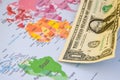US dollar banknotes on globe world map, American investment and trading Royalty Free Stock Photo