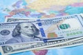 US dollar banknotes on world globe map background. Royalty Free Stock Photo