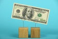 US dollar decline illustrated over blue Royalty Free Stock Photo