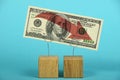 US dollar decline illustrated over blue Royalty Free Stock Photo