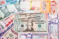 US Dollar with a pile of Asian currency note Royalty Free Stock Photo