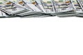 100 US dollars bills lies on top side of screen isolated on white background Royalty Free Stock Photo