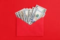 US dollars in cash in envelope on red minimal background Money mail concept Royalty Free Stock Photo