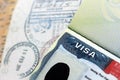 US Embassy visa in passport page with stamps on office table Royalty Free Stock Photo