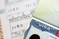 US Embassy visa in passport page with stamps on office table Royalty Free Stock Photo