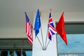 The US, EU, UK, and Moroccan flags hanging on the entrance of a luxury hotel