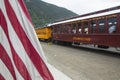 US Flag and Durango and Silverton Narrow Gauge Railroad Steam Engine Train, Silverton, Colorado, USA