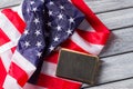 US flag beside old book. Royalty Free Stock Photo