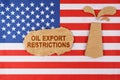 On the US flag there is an oil rig cut out of cardboard and a sign with the inscription - oil export restrictions