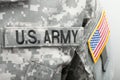 US flag and U.S. ARMY patch on military uniform - close up studio shot Royalty Free Stock Photo