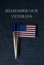 US flags and text remember our veterans Royalty Free Stock Photo