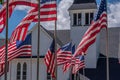 US flags wave outside white church on Memorial Day Royalty Free Stock Photo