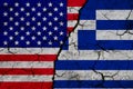 US and Greece flag on textured cracked ground. The concept of cooperation between the two countries. 3d rendering Royalty Free Stock Photo