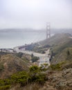 US Highway 101 crossing the Golden Gate Bridge with haze and fog in the Bay. Seen from Slackers Hill on the Marin Headlands Royalty Free Stock Photo