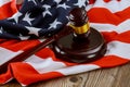 US legal office with USA lawyers in the judge& x27;s gavel on American flag wooden table Royalty Free Stock Photo