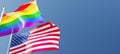 us and lgbt flags fluttering in the wind against a blue sky mockup with copy space. usa national symbols and rainbow flag 3d Royalty Free Stock Photo