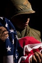 US Marine Vietnam War holding American flag. Royalty Free Stock Photo