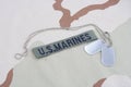 US MARINES branch tape with dog tags on desert camouflage uniform Royalty Free Stock Photo